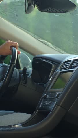 Hand pressing car engine start button. Starting vehicle using modern ignition technology. Person ready to driving car