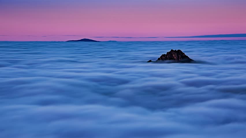 Time Lapse of Clouds Flowing Like Sea in Foggy Mountains at Blue Hour Sunset - Powered by Shutterstock - Get 15% off with code: PIKWIZARD15