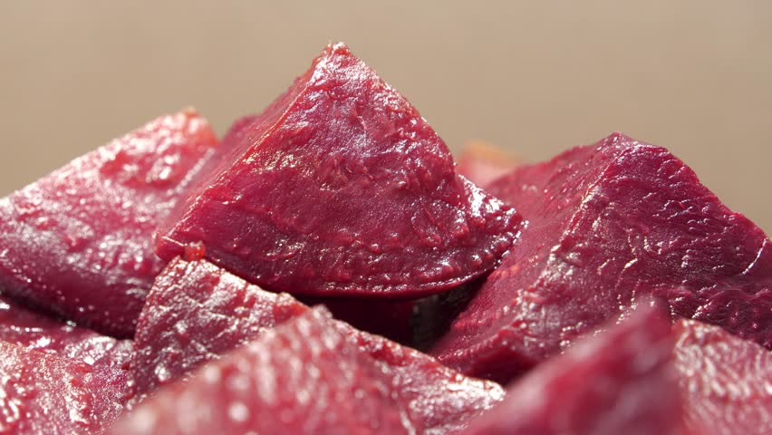 Boiled red beetroot cut into pieces, close-up shot