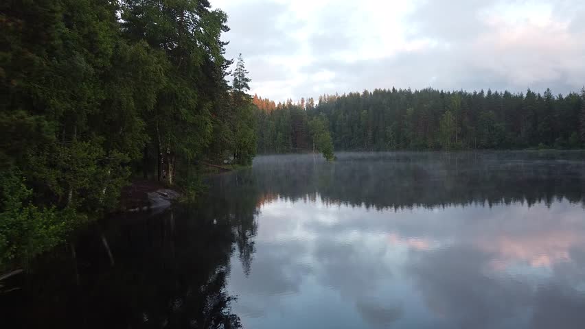 Morning Fog Over Forest Lake in Norway