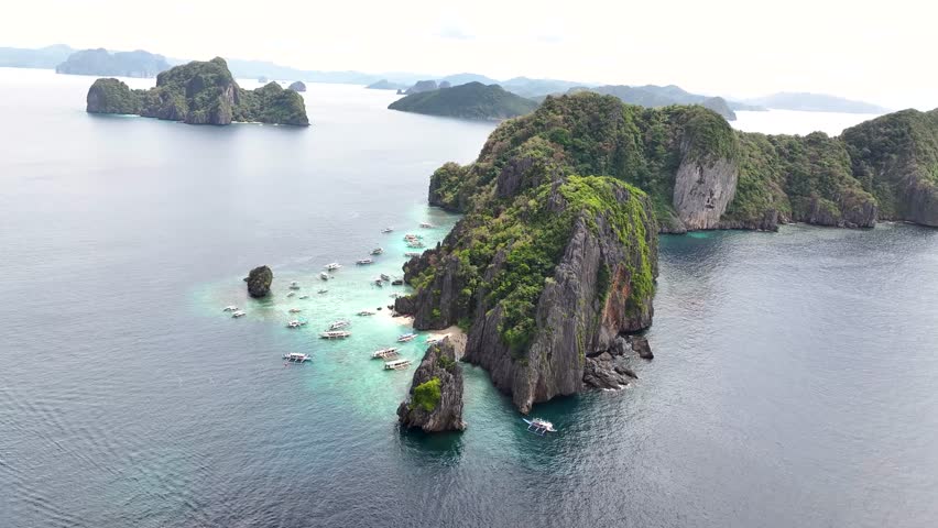 El Nido, Philippines aerial view showcasing clear turquoise waters and stunning limestone cliffs