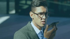 Man lifting smartphone and calling outside office, monitoring animated finance chart rising. Business, analytics, technology, professional, urban, financial, data - Powered by Shutterstock - Get 15% off with code: PIKWIZARD15