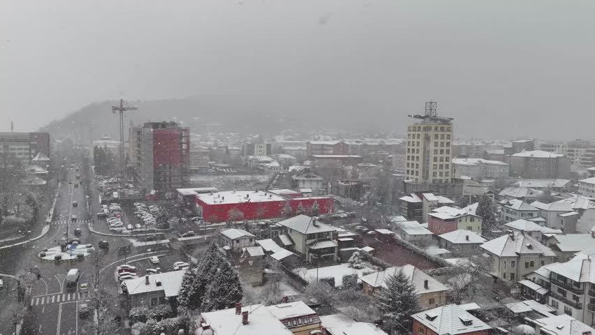 The Romania capital blanketed in fresh snow, seen from above in a peaceful winter cityscape