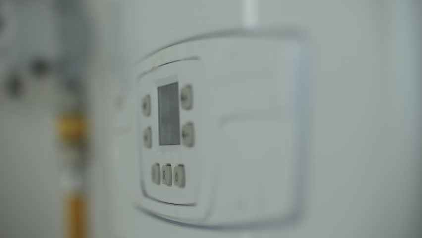 Control panel of a modern gas boiler in focus