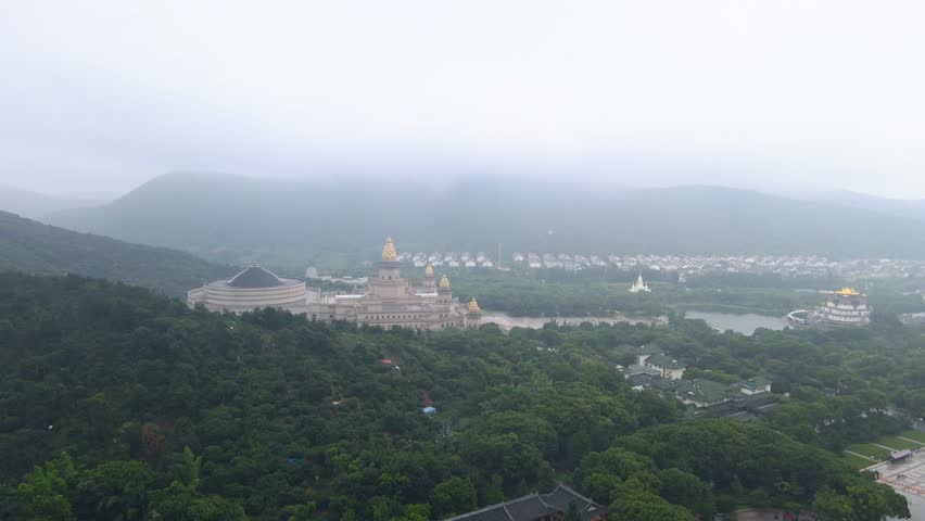 Aerial view of lingshan shengjing brahma palace and scenic landscape on a cloudy day in wuxi, china