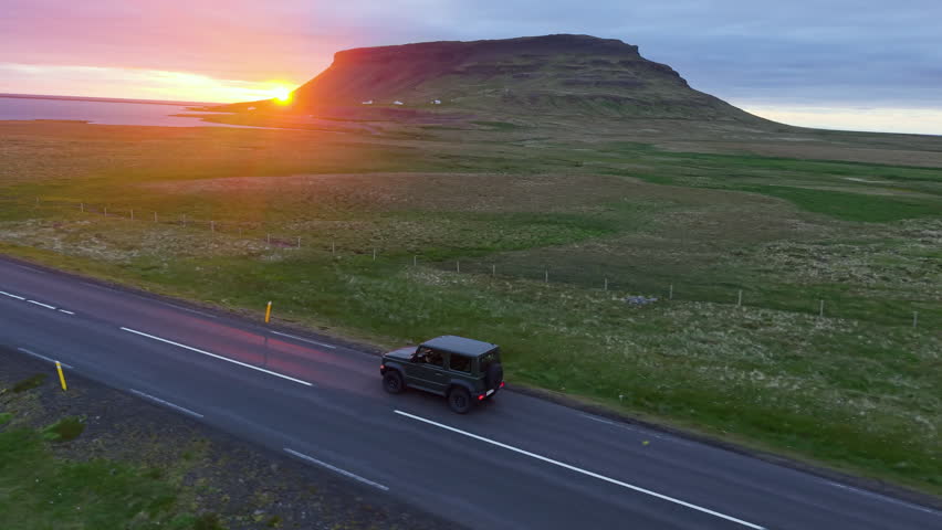 Car Through Iceland Landscape mountains Epic Scenic Road Trip Scene.