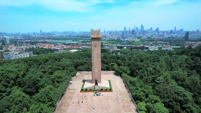 Aerial view of Nanjing Yuhuatai Scenic Area monument and lush greenery on a bright summer day in Jiangsu province, China