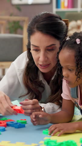 Therapist, woman and girl with building blocks, support and counseling for behavior. Person, psychology and patient with child development, toys and consultation with appointment, help and wellness