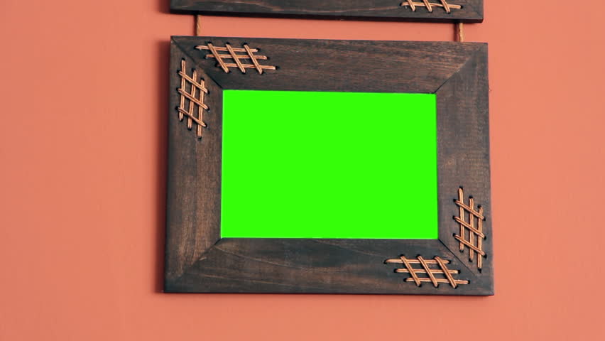 Close-Up of Rustic Wooden Picture Frame With Green Screen on Wall  - Powered by Shutterstock - Get 15% off with code: PIKWIZARD15