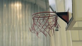 Basketball Scoring Through Worn Hoop in Indoor Gym - Close Up - Powered by Shutterstock - Get 15% off with code: PIKWIZARD15