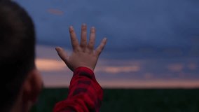 Child Reaching for the Sky, Small Hand in Blue Twilight, Hopeful Hand at Sunset, Innocence in the Evening Light, Kid s Hand and Dusk Sky, Dreaming Beyond the Horizon, Reaching for Tomorrow, Little - Powered by Shutterstock - Get 15% off with code: PIKWIZARD15