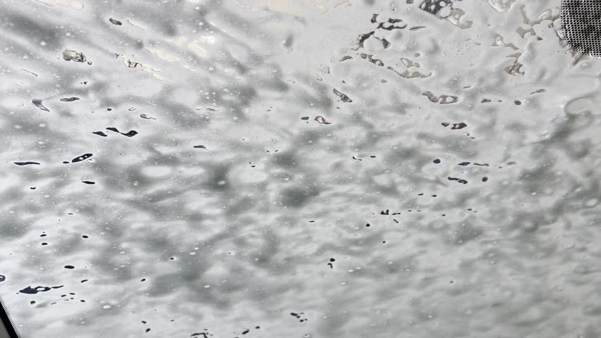 Car wash - suds flow down the windshield