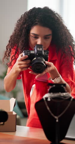 Camera, jewelry and marketing with woman in boutique store for advertising of products for sale. Designer, necklace and photography with creative retailer in small business or startup for display