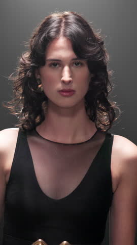 Woman, model and walking with dress in fashion show for runway, style or met gala event. Female person, stylist or designer with clothing on catwalk or walkway for glamour, trend or brand collection