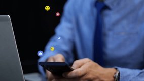 Businessman on social media during office break. 3D emoji icons like heart and smile float over the phone. Graphic animation - Powered by Shutterstock - Get 15% off with code: PIKWIZARD15
