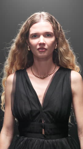 Woman, face and fashion show on runway with dress for garment showcase, style or met gala event. Female person, stylist or designer with clothing on catwalk or walkway for glamour or brand design