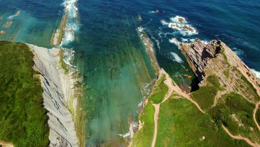Breathtaking aerial perspective of zumaia's unique flysch coastline, showcasing geological formations and the beauty of basque country