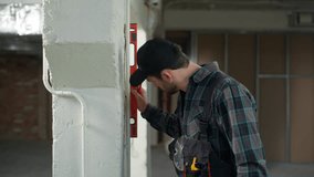 Man builder architect repairman checking wall building level measure inspecting apartment renovation construction tool Caucasian guy male engineer handyman foreman inspector writing measurement gauge - Powered by Shutterstock - Get 15% off with code: PIKWIZARD15