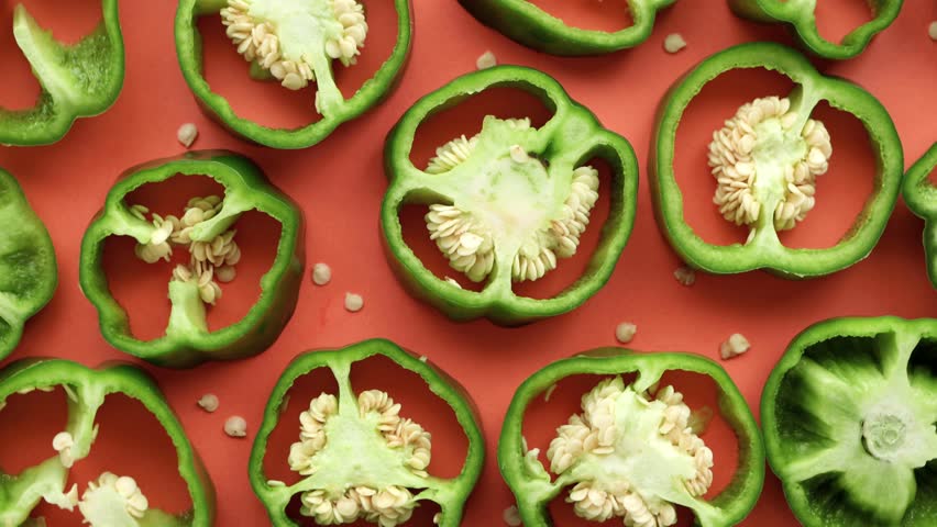 Sliced ​​green peppers. Green peppers with seeds.