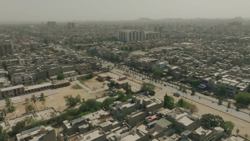 Aerial drone view of Karachi, Pakistan, in foggy smog.