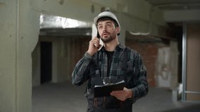 Caucasian man builder architect call mobile phone male engineer in helmet work at construction site control building process foreman industrial worker talking cellphone command architecture project - Powered by Shutterstock - Get 15% off with code: PIKWIZARD15