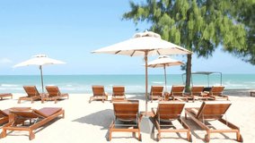 Tropical Beach Resort Relaxation: Sunbeds, Umbrellas, and Ocean View - Powered by Shutterstock - Get 15% off with code: PIKWIZARD15