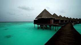 Overwater Bungalows, Tropical Island Resort, Turquoise Lagoon, Wooden Jetty, Cloudy Sky - Powered by Shutterstock - Get 15% off with code: PIKWIZARD15
