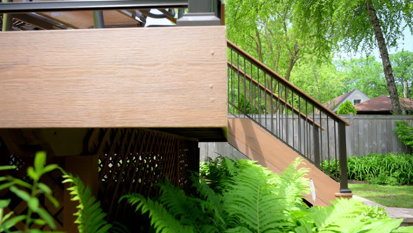 Element of the exterior, new deck with stairs on the backyard , slow move wide camera shot