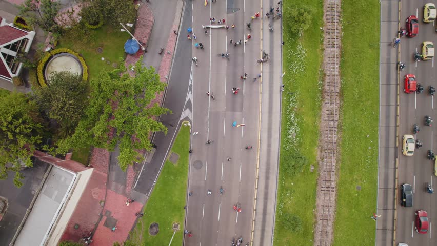 Man Holding Colombian Flag During Protest on Street – Bogotá, Colombia