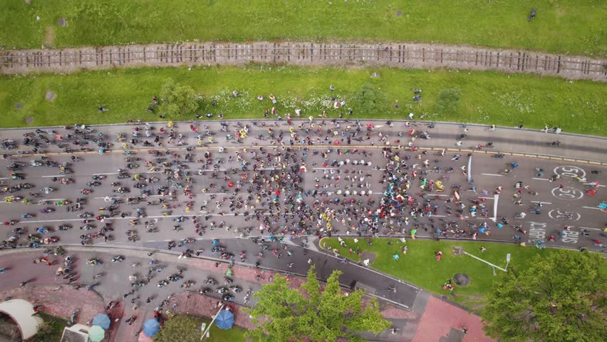 Peaceful Protest March With Drummers, Bikes and Flags in Highway, Aerial View– Bogotá, Colombia