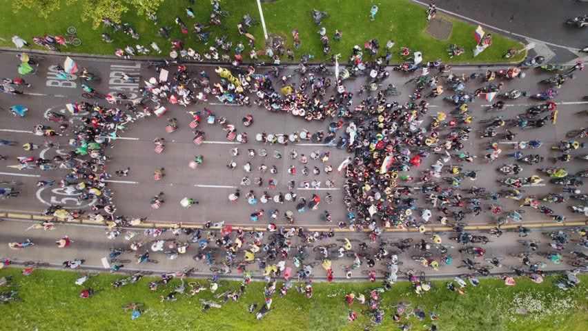 Peaceful Protest March With Drummers, Bikes and Flags in Highway, Aerial View– Bogotá, Colombia