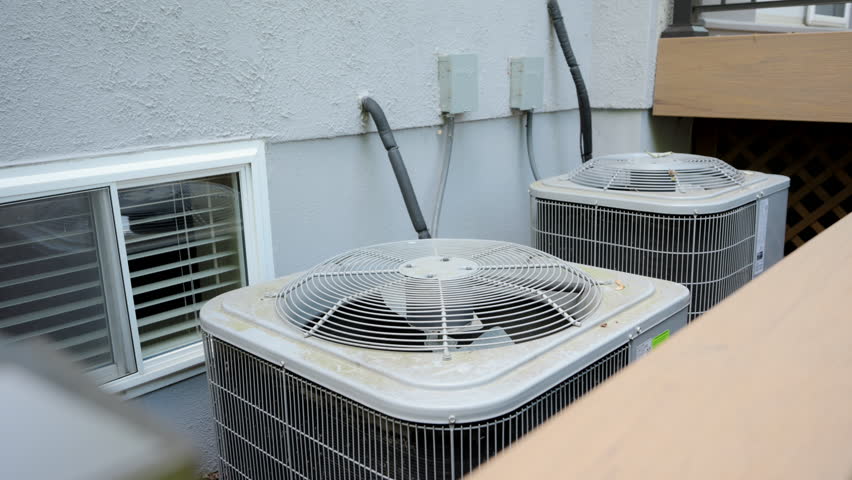 Home HVAC Air Conditioner system outside the house. Move camera shot
