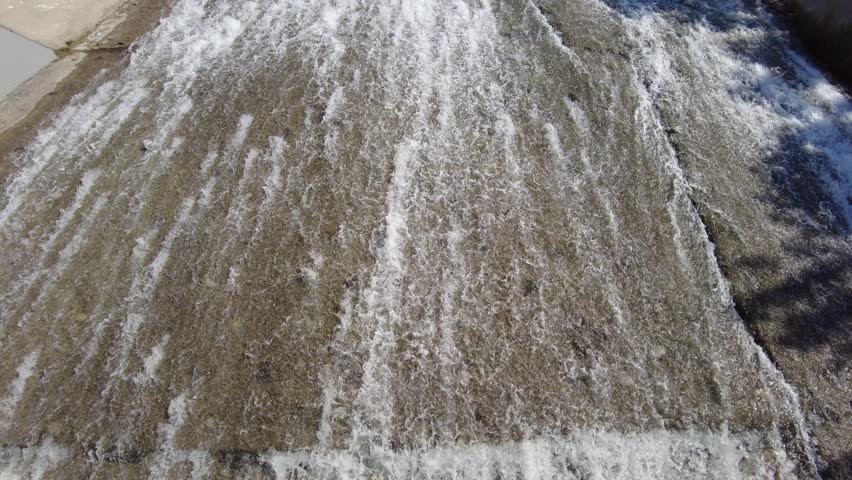 water flows through a concrete river channel