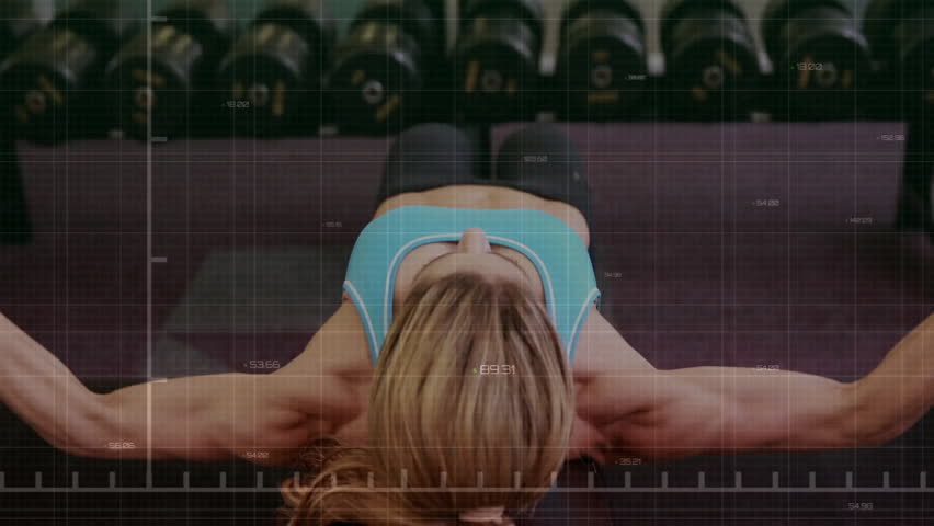 Woman lying on bench initiating chest fly in gym with animated green graph measuring lift intensity. Strength, training, biomechanics, data visualization, health, performance, workout