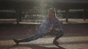 Woman shifting weight into side lunge in brick plaza near bench, holographic globe pulsing wellness. Exercise, wellness, fitness, outdoor, modern, technology, lifestyle - Powered by Shutterstock - Get 15% off with code: PIKWIZARD15