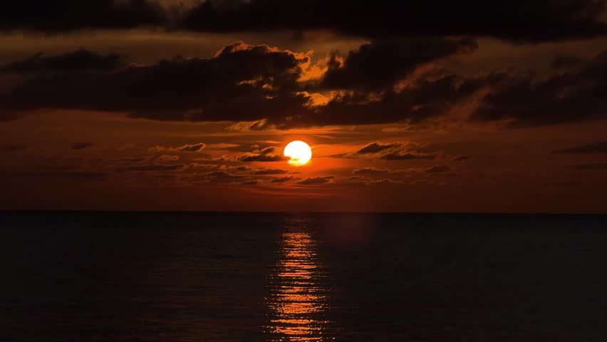 Underexpose video of sunset at Gaya Island, Kota Kinabalu, Sabah, Malaysia shot with Apple's Iphone 15 Pro Max. Kota Kinabalu is one of the top destination for tourist to watch sunsets.