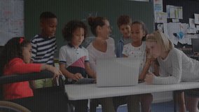 Teacher opening laptop for coding, students watching, boy tapping keyboard updating code overlay. Educational, classroom, technology, digital, innovative, collaborative, learning - Powered by Shutterstock - Get 15% off with code: PIKWIZARD15