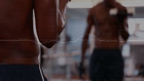 Man picking dumbbells in gym and performing bicep curls in front of mirror for muscle growth. Strength, fitness, workout, bodybuilding, training, motivation, reflection - Powered by Shutterstock - Get 15% off with code: PIKWIZARD15