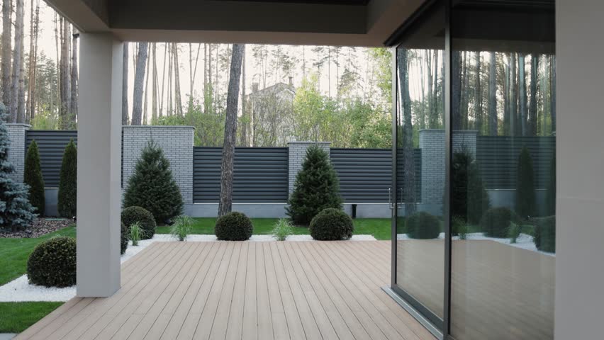 A beautifully designed modern home patio with an exquisite view of the surrounding garden landscape