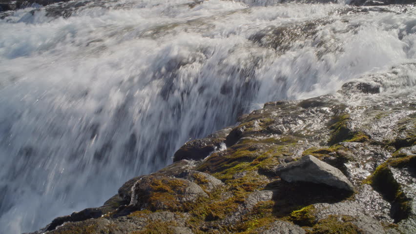 Close-up of river rapids flowing in mountain landscape in the West Fjords in Iceland.