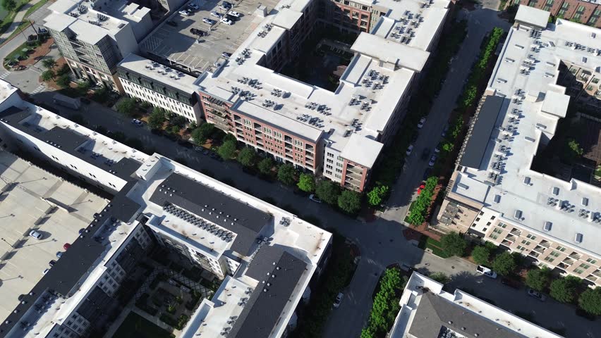 Tree lined street busy parked cars modern urban apartment complex with courtyard in mixed-use development Cypress Waters, Dallas, corporate office buildings, commercial zones, multilevel parking. USA