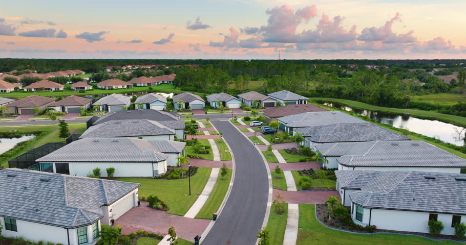 American gated community houses in rural US suburbs. View from above of large residential homes in small town in southwest Florida