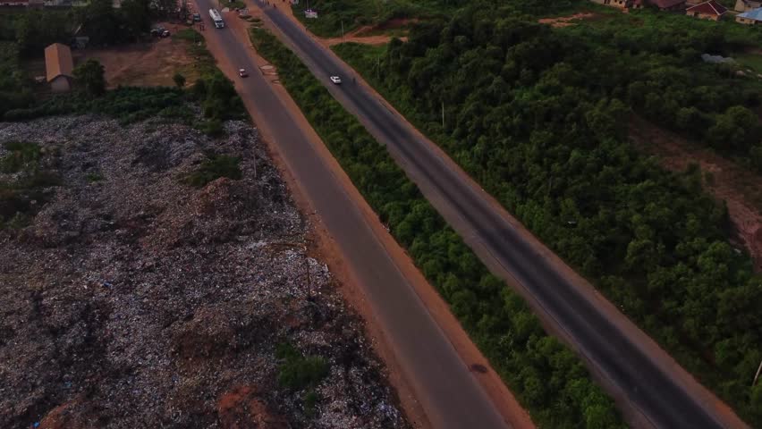 Aerial of the busy Lagos-Ibadan Expressway with cars and trucks driving over the road in Nigeria, Africa