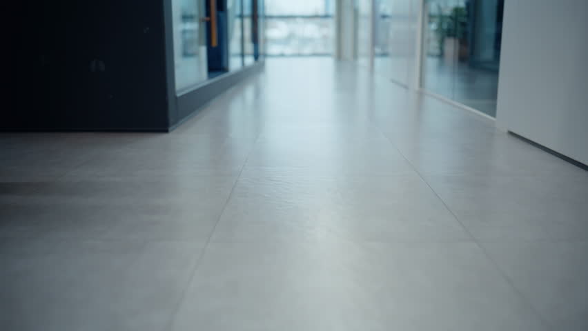 Businessman legs stepping office floor going on meeting closeup. Unrecognizable man director walking grey vestibule alone. Successful professional worker strolling to private cabinet in elegant shoes 
