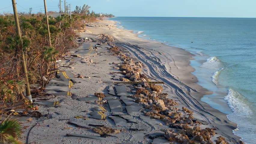 Hurricane Milton storm surge destroyed Manasota Key road at Blind Pass Beach. Severe damage to waterfront infrastructure in Florida