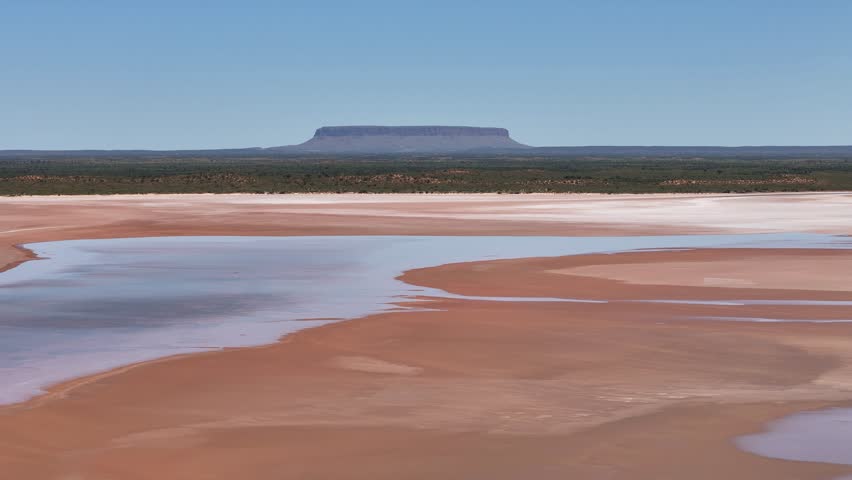 Aerial Lake Amadeus salty mud basin is the largest salt lake in Northern Territory Australia, stretching 180 kilometers long and 10 kilometers wide, salt lake and sand islands