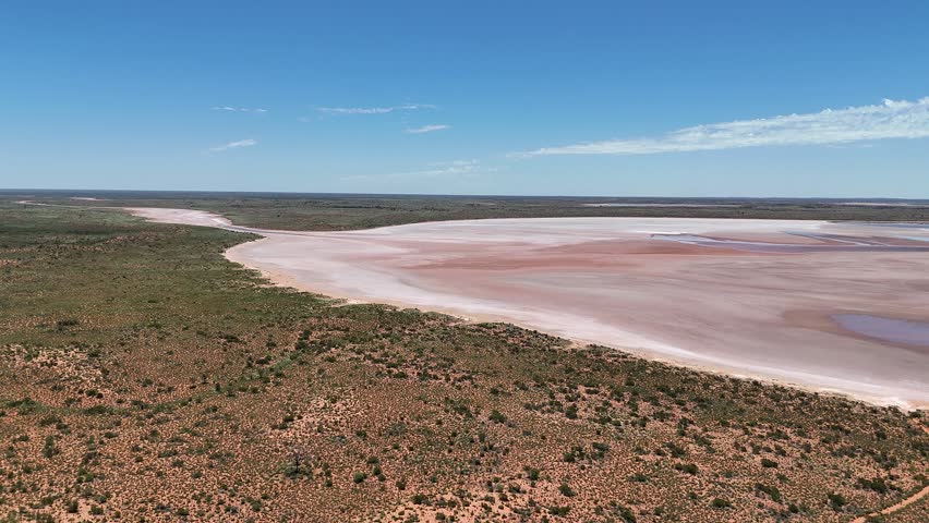 Aerial Lake Amadeus salty mud basin is the largest salt lake in Northern Territory Australia, stretching 180 kilometers long and 10 kilometers wide, salt lake and sand islands
