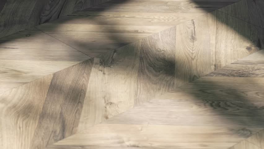 An elegant parquet floor design, illuminated by soft natural light, showcasing intricate patterns and details