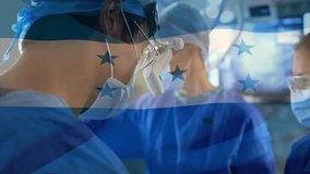 Surgeon focusing on patient during surgery after Honduras flag rippling, assistants handing tools. Medical, healthcare, teamwork, professionalism, clinical, sterile, precision - Powered by Shutterstock - Get 15% off with code: PIKWIZARD15