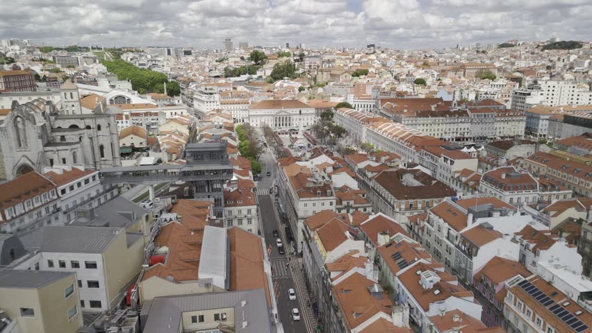 Drone flies north, passing by the Elevador de Santa Justa in Lisbon, Portugal